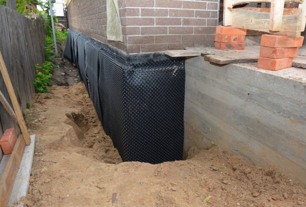 Happy homeowners after waterproofing job in New Palestine